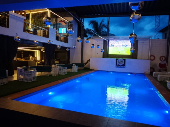 De-Latinos illuminated swimming pool and lounge area