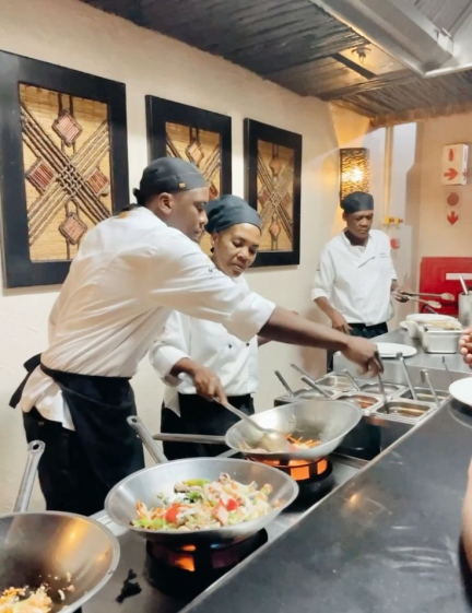 Kitchen team preparing meals